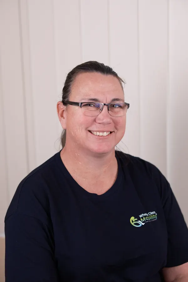 Kerry, owner of Wheely Clean Mobility, wearing a branded shirt.