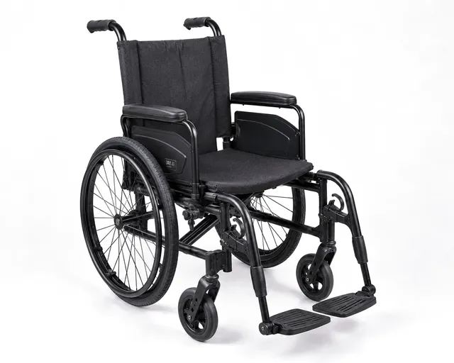 The wheelchair fully reassembled and clean, ready to be handed back.