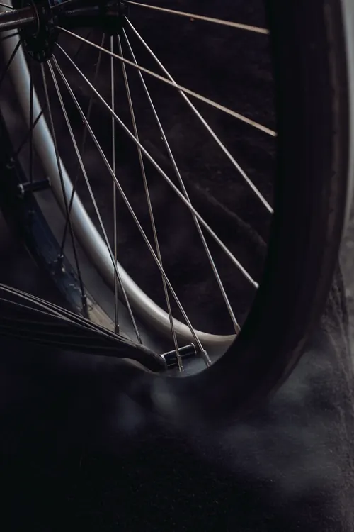 Close detail of a cleaned wheelchair wheel rim and spokes.